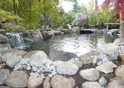 This beautiful pond was constructed by Koi Gardens, and was designed specifically for koi. This pond is four feet deep and designed to keep.