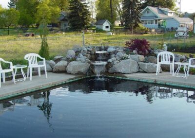 These homeowners turned their swimming pool into a koi pond. Koi Gardens added the proper equipment and a waterfall to give their friendly koi a great.